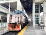 Tri-Rail GP49PH-3 # 812 rests with its three car Tri-Rail train at Miami Airport Station between assignments